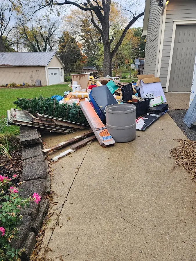 Dumpster being loaded with debris for Demolition Dumpster Rental in South Plainfield